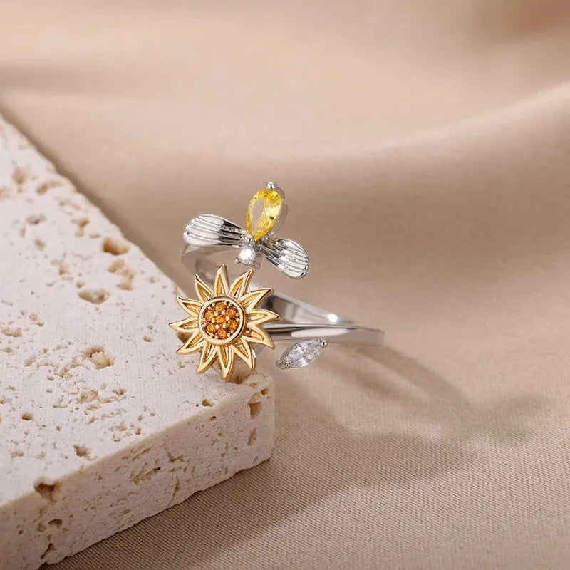 Geometric rotatable ring with adjustable opening in gold electroplated finish on copper base