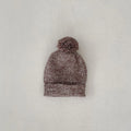 Dark brown baby girl three-piece clothing set with knitted hat, blouse and shorts