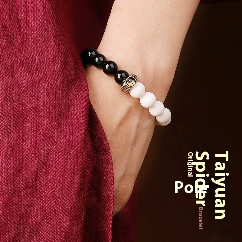 Black and white Tai Chi bracelet with obsidian beads and mantra charm