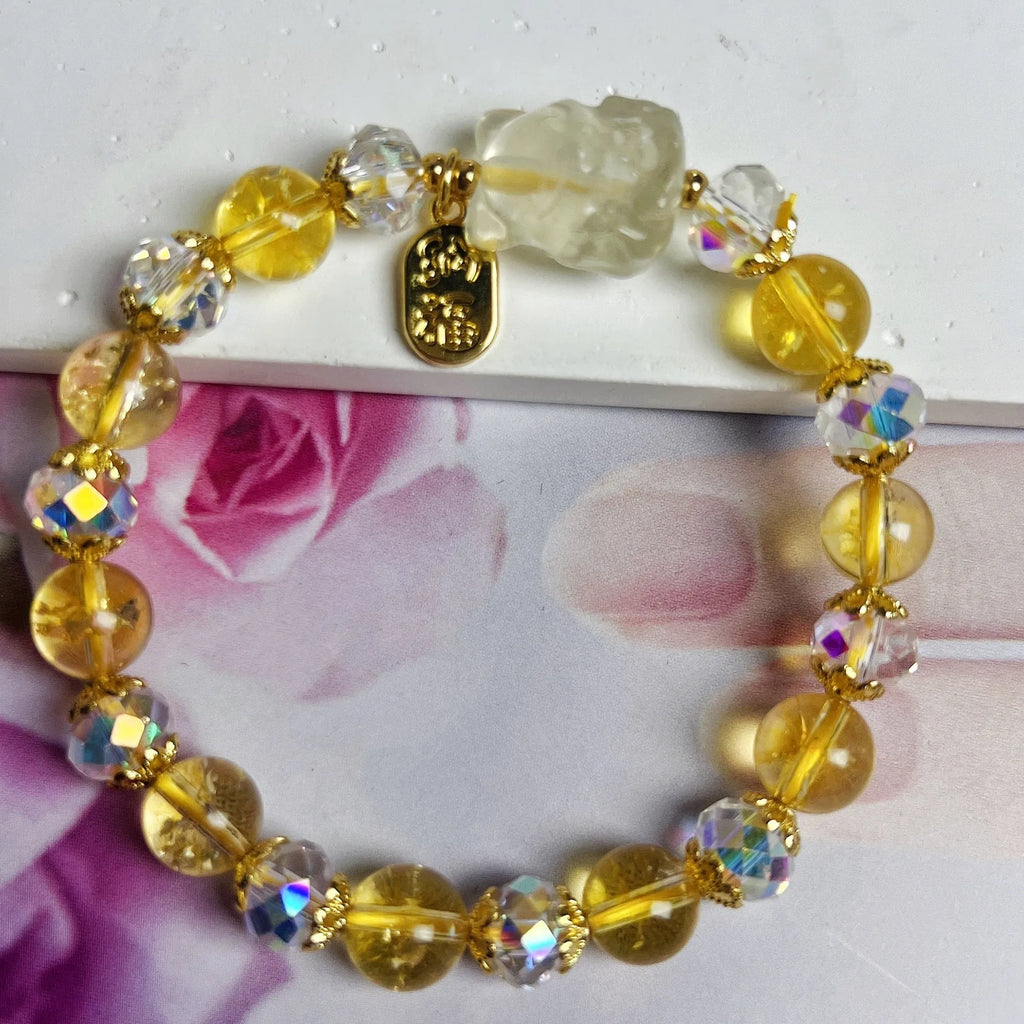 Women's crystal bracelet with a detailed nine-tail fox charm in natural citrine.