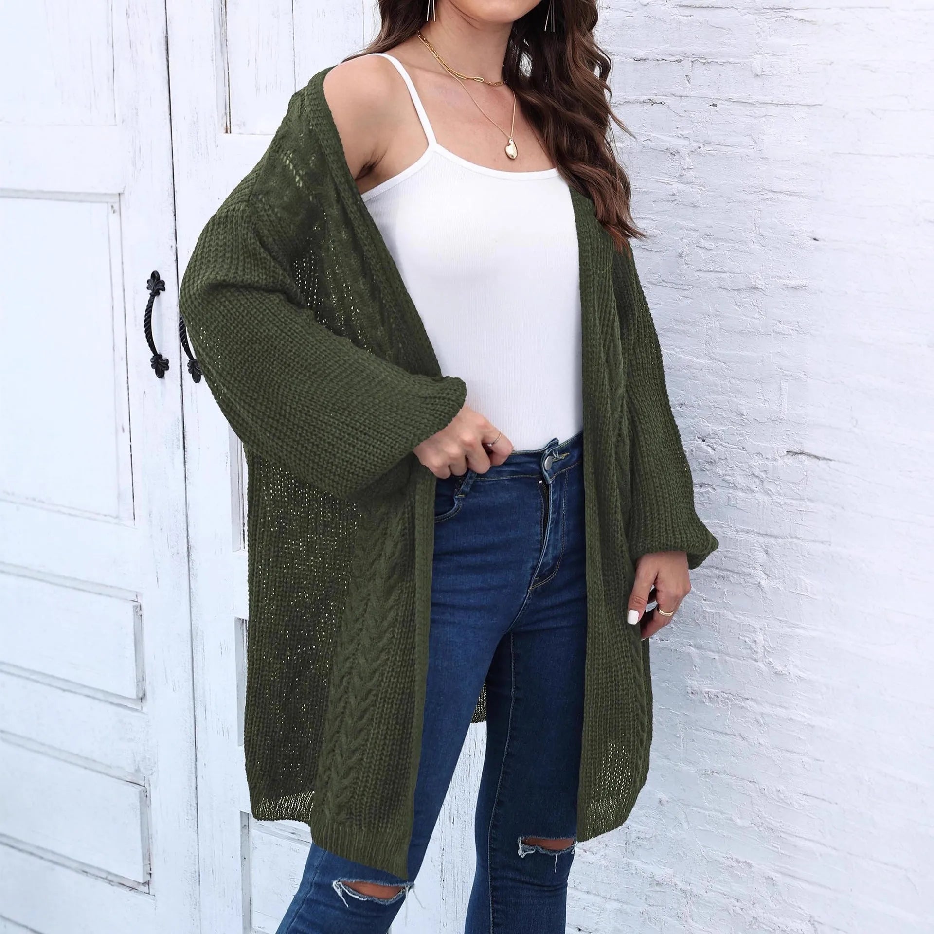 Brown loose-fitting acrylic sweater coat for women on a hanger.