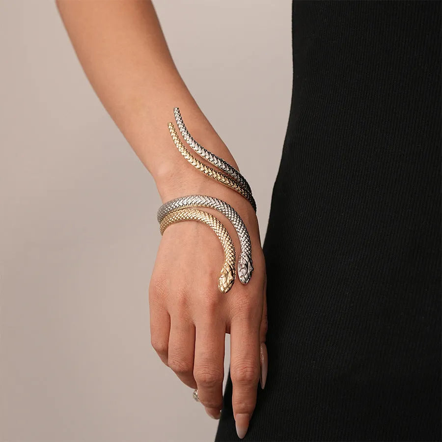 Gold metal snake-inspired ring and bracelet set with exaggerated twisted winding design