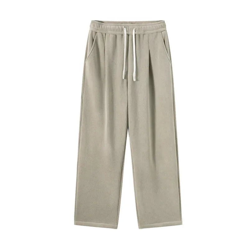 Men's apricot coloured loose-fit polar fleece winter sports pants with a drawstring waist.