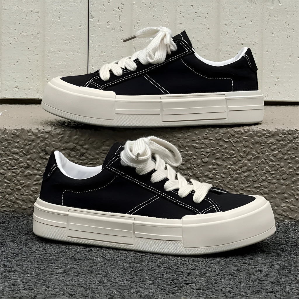 Canvas platform casual skate shoes with lace-up, tassel detail, and rubber sole in black and gray
