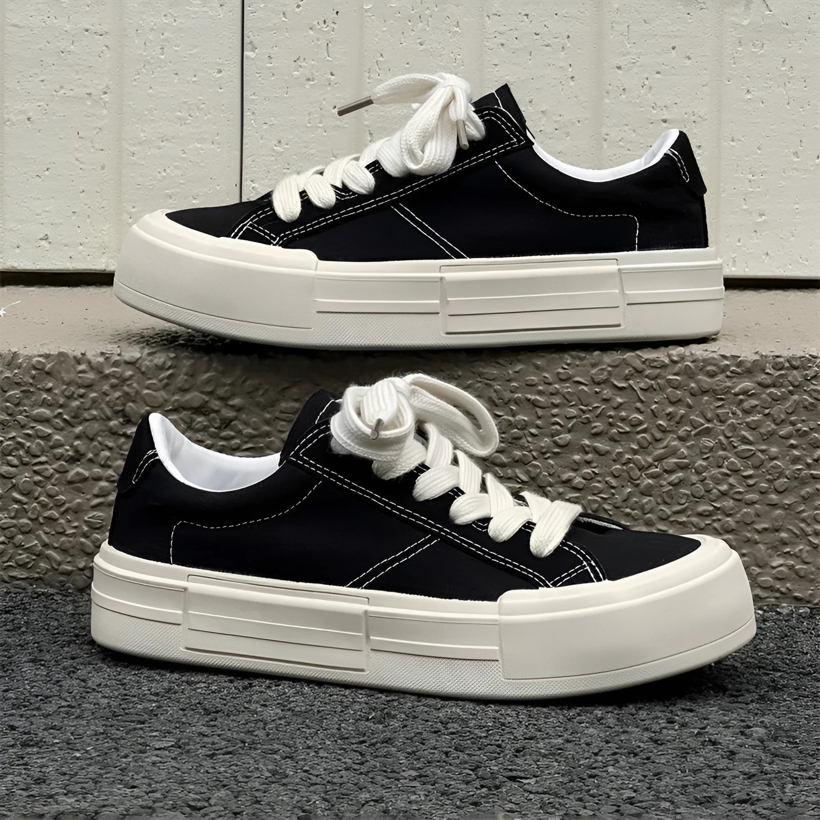 Canvas platform casual skate shoes with lace-up, tassel detail, and rubber sole in black and gray
