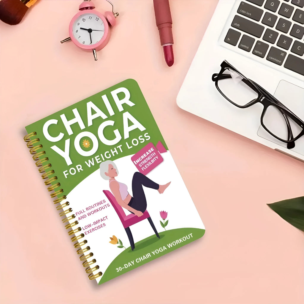Green coil-bound 30-day chair yoga training notebook open to daily plan page