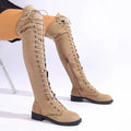 Black lace-up over-the-knee boots with a round toe, flat rubber sole, and decorative leather stitching on the upper.