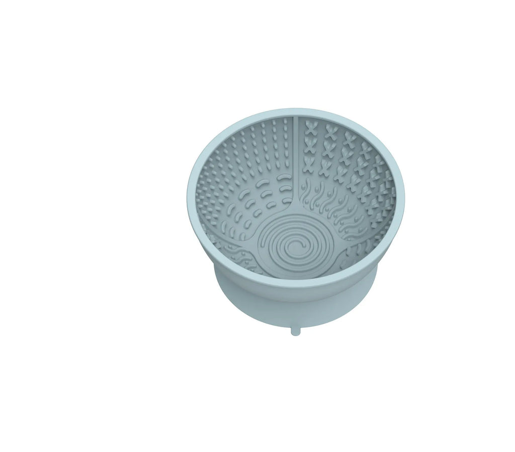 Cyan silicone pet bowl with textured licking mat surface and suction cup base.