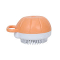 Orange silicone dog bath brush with shampoo dispenser and soft TPR bristles for pet grooming