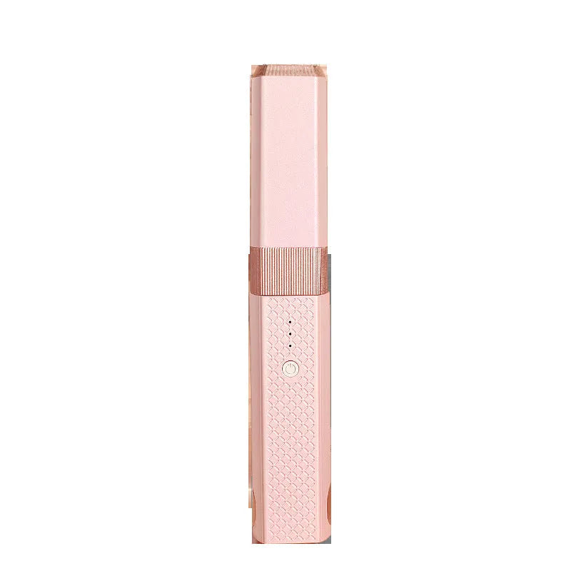 Pink and green cordless USB hair straightener with ceramic plates and digital temperature display.