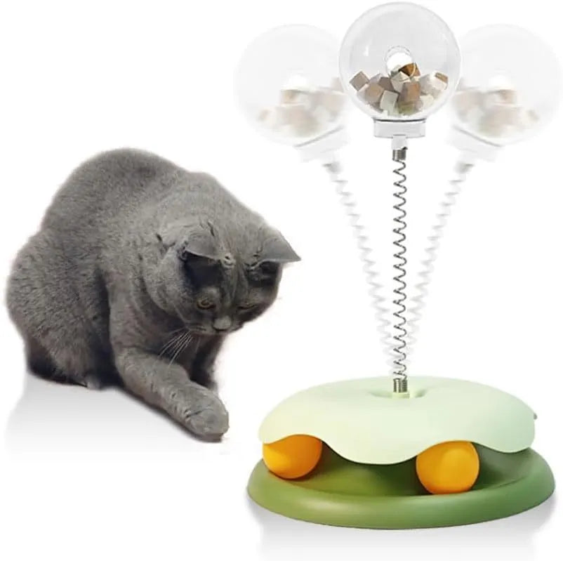 Blue and green cat treat dispenser toy with track ball, a slow feeder puzzle for indoor cats.