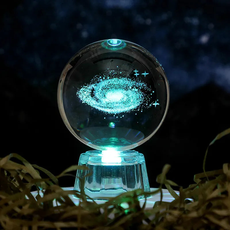 Transparent 6cm crystal ball ornament with inner carving on a fixed base, modern minimalist decor.
