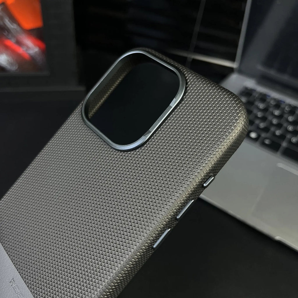 Black magnetic iPhone case with dragon scale texture and leather-style stitching, shown on an iPhone 15 Pro Max.