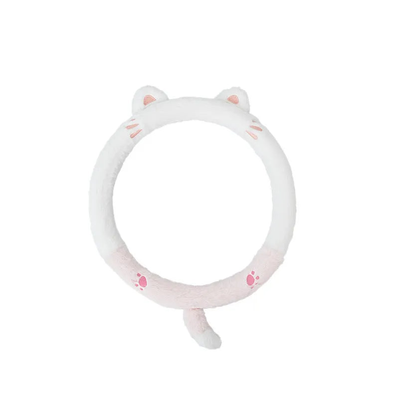 Plush cartoon animal steering wheel cover with embroidery, shown fitted on a car wheel.