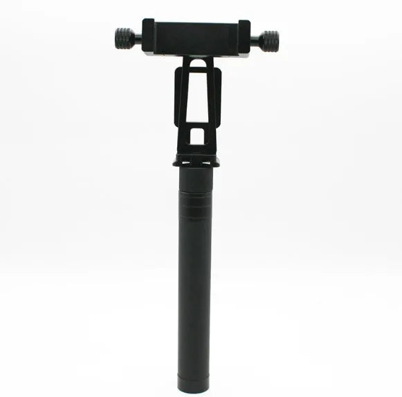 Black retractable aluminium selfie stick extended in hand next to a smartphone.