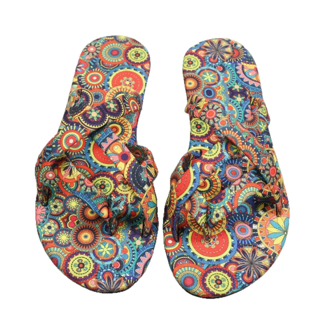 Women's flat printed slippers in bohemian ethnic style with cloth upper and rubber sole, available in multiple colours and sizes 36-43