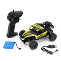 Blue 1:18 scale remote control off-road drift car with 2.4Ghz transmitter on a flat surface.