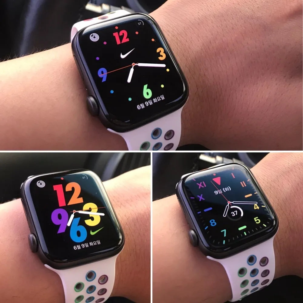 Black silicone sports wristband with buckle, holding a mobile phone, shown on a person's wrist.