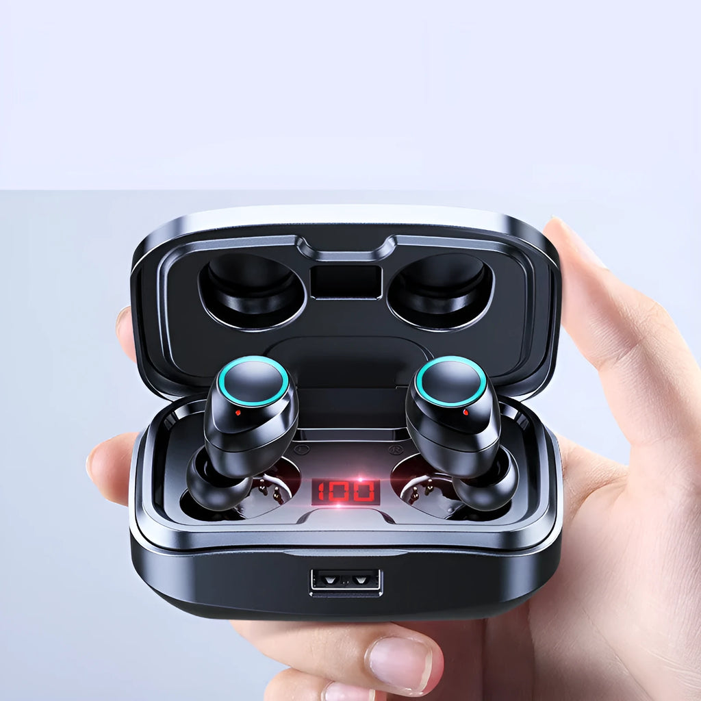Black wireless Bluetooth in-ear earphones with a charging case on a table.