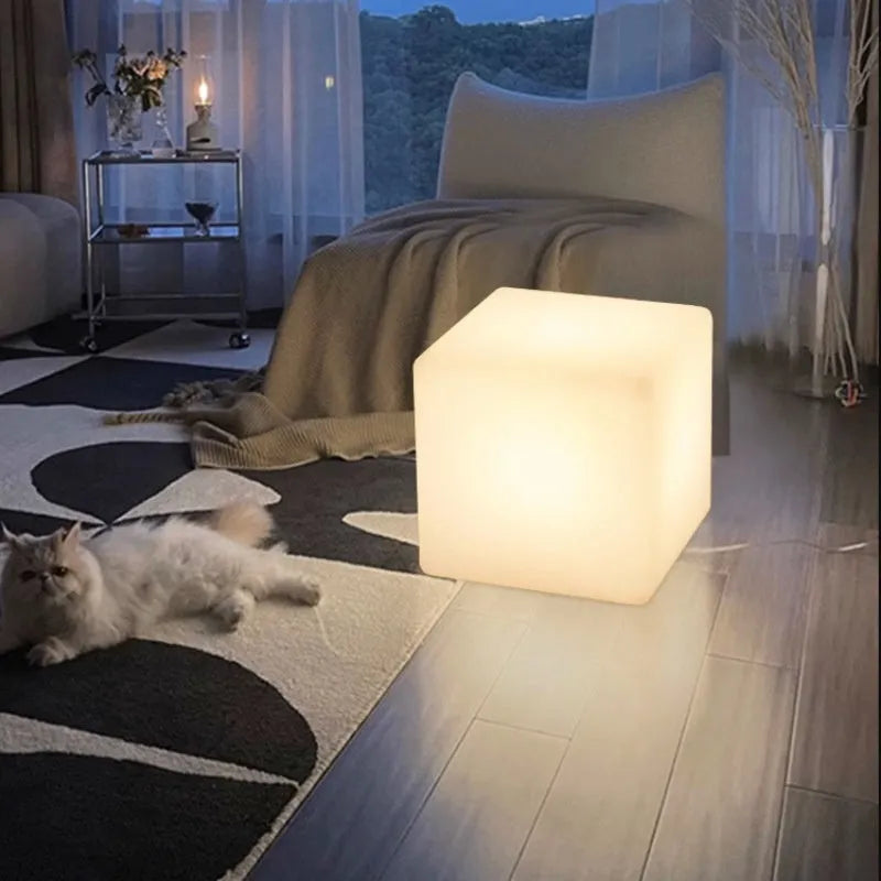 A modern square LED cube light stool for outdoor gardens, available in multiple sizes.
