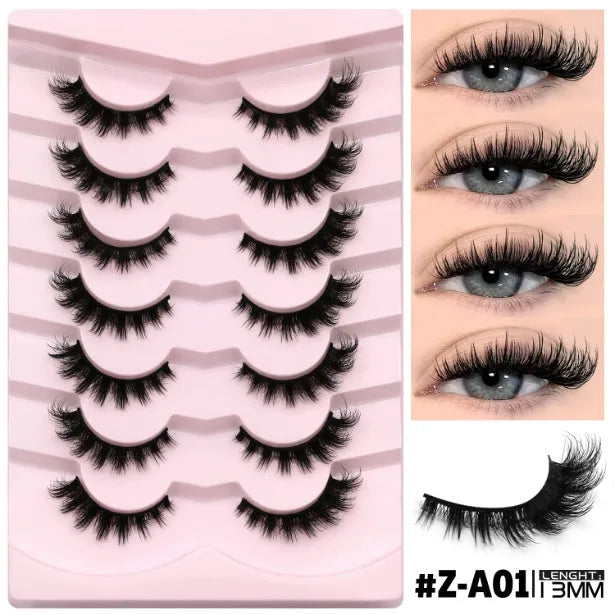 Box of artificial fibre false eyelashes in a natural long thick style with adhesive glue.
