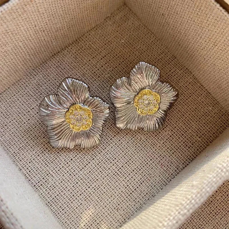 Pair of copper gardenia stud earrings with textured petals in a two-tone electroplated finish