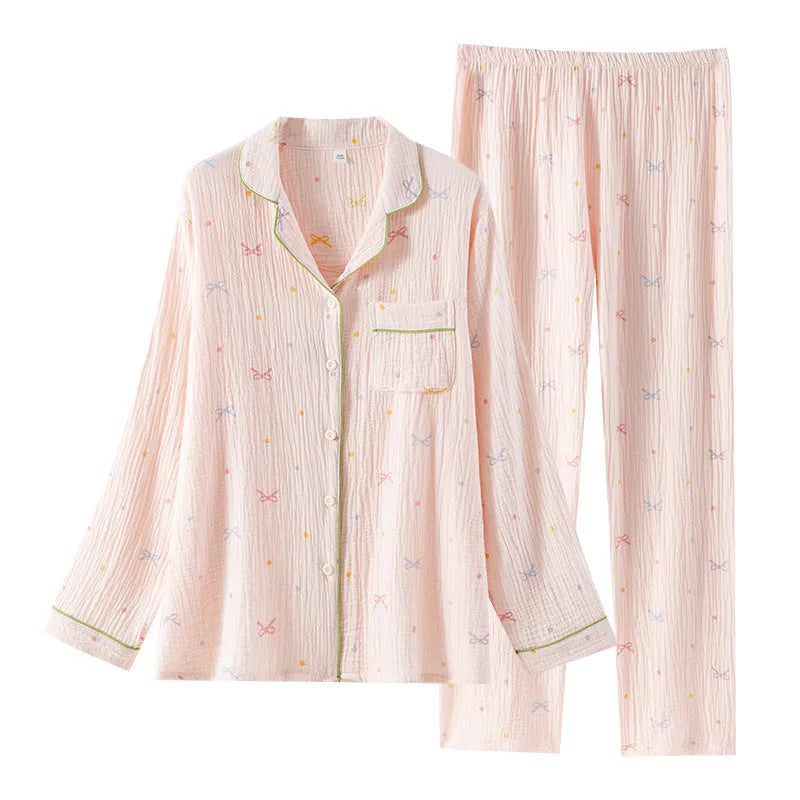 Women's long sleeve cotton pyjama set in pink, featuring a casual top and trousers.
