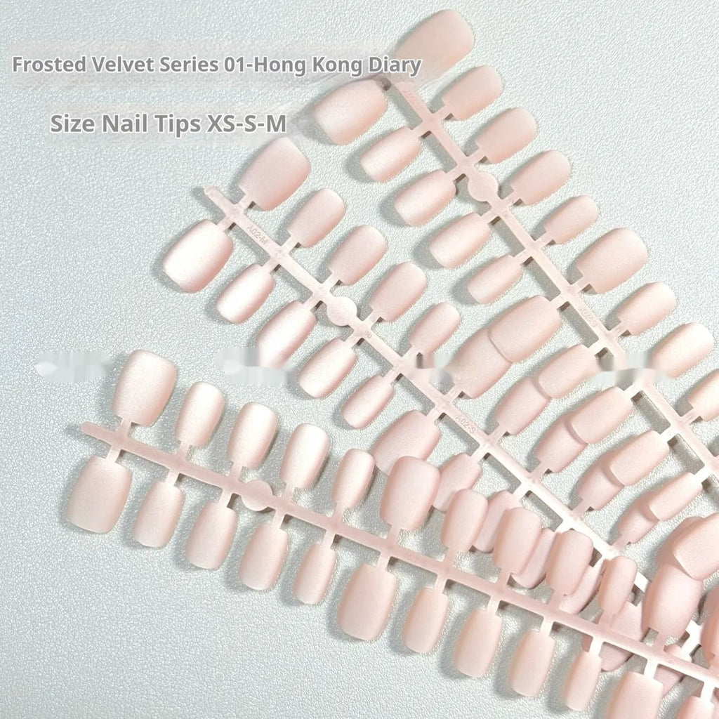 Set of frosted velvet false nails with Cat's Eye Aurora shine on a short ladder shape.