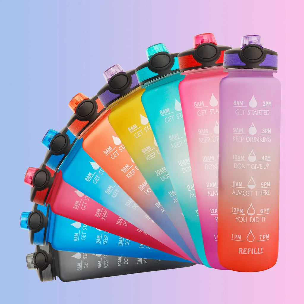 Blue and red gradient 1-litre Tritan sports water bottle with time markers, flip-top lid, and wrist strap.