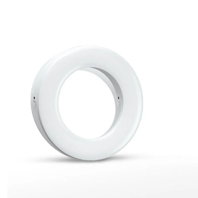 Compact black LED ring light for mobile phone photography with USB cable.