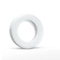 Compact black LED ring light for mobile phone photography with USB cable.