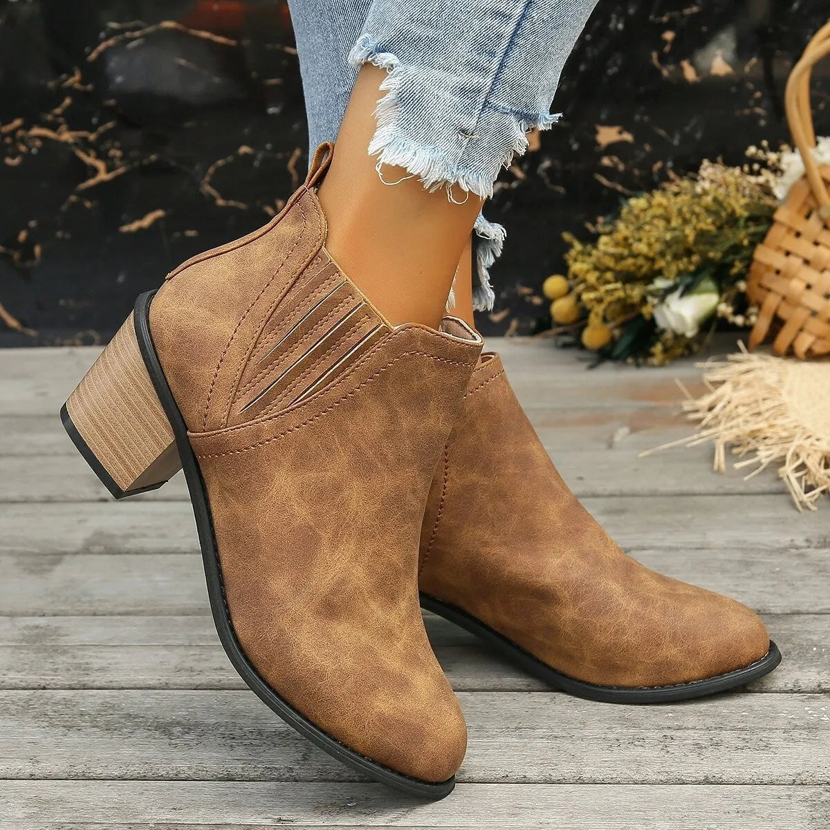 Women's black ankle boots with pointed toe and thick square heel slip-on design