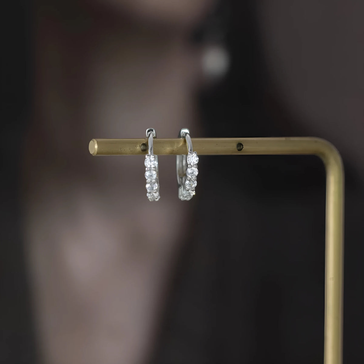 925 silver geometric stud earrings in white gold finish on white background
