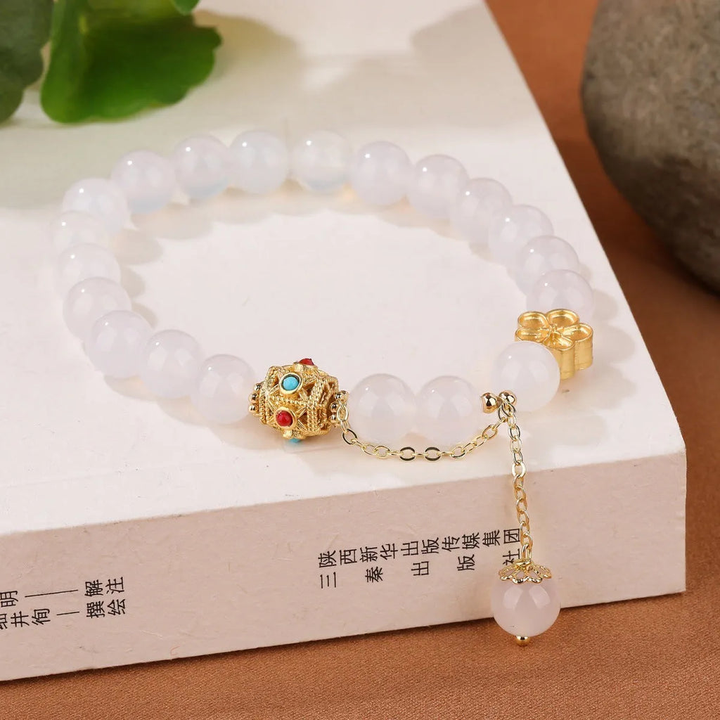 Natural agate bracelet with peach blossom stones and copper components, approximately 8mm bead size