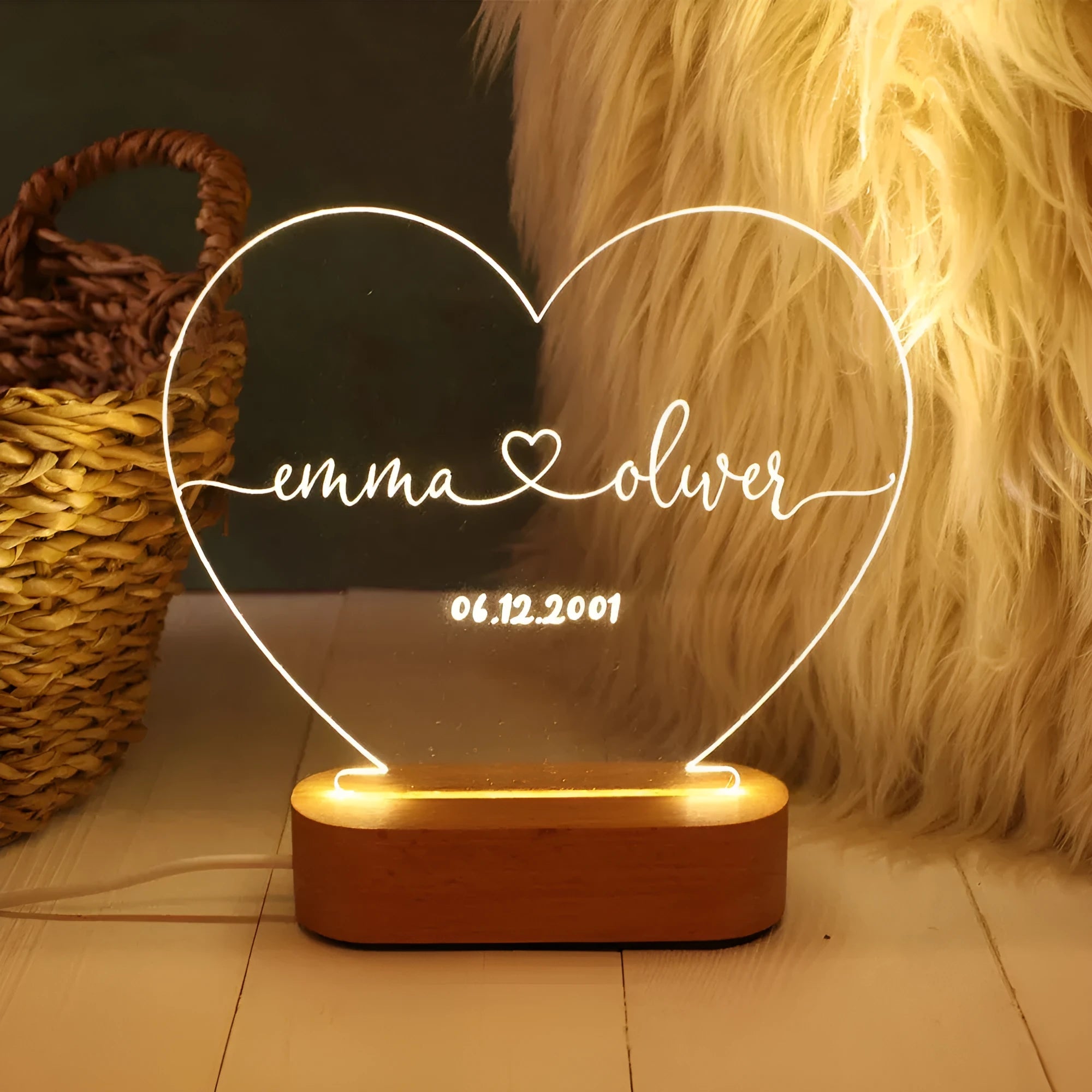 Custom transparent acrylic night light engraved with personal names and a date.
