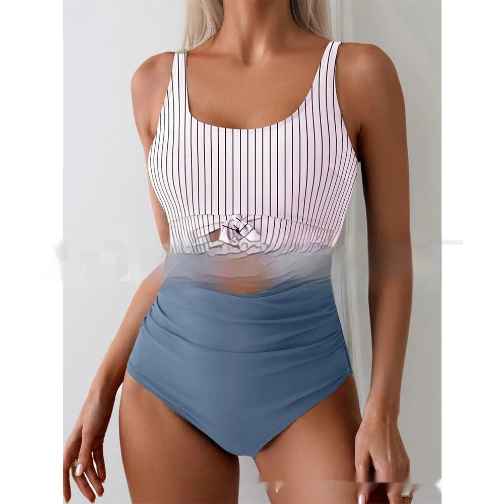 One-piece female swimsuit with contrast colour straps and covered belly in rose-red and black