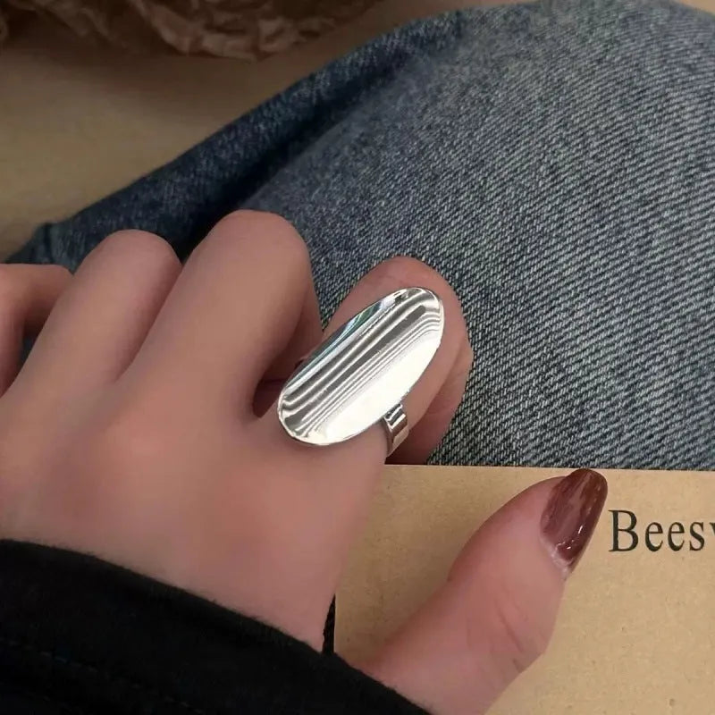 Geometric open ring for women in glossy electroplated silver tone on copper, adjustable band