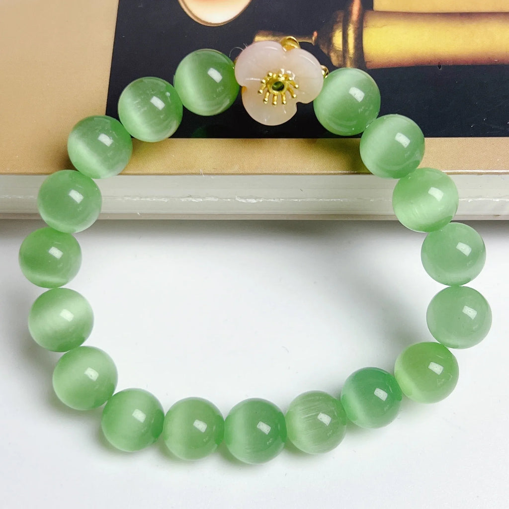 Women's handmade glass beaded bracelet with floral design in yellow, pink, white, or green colours