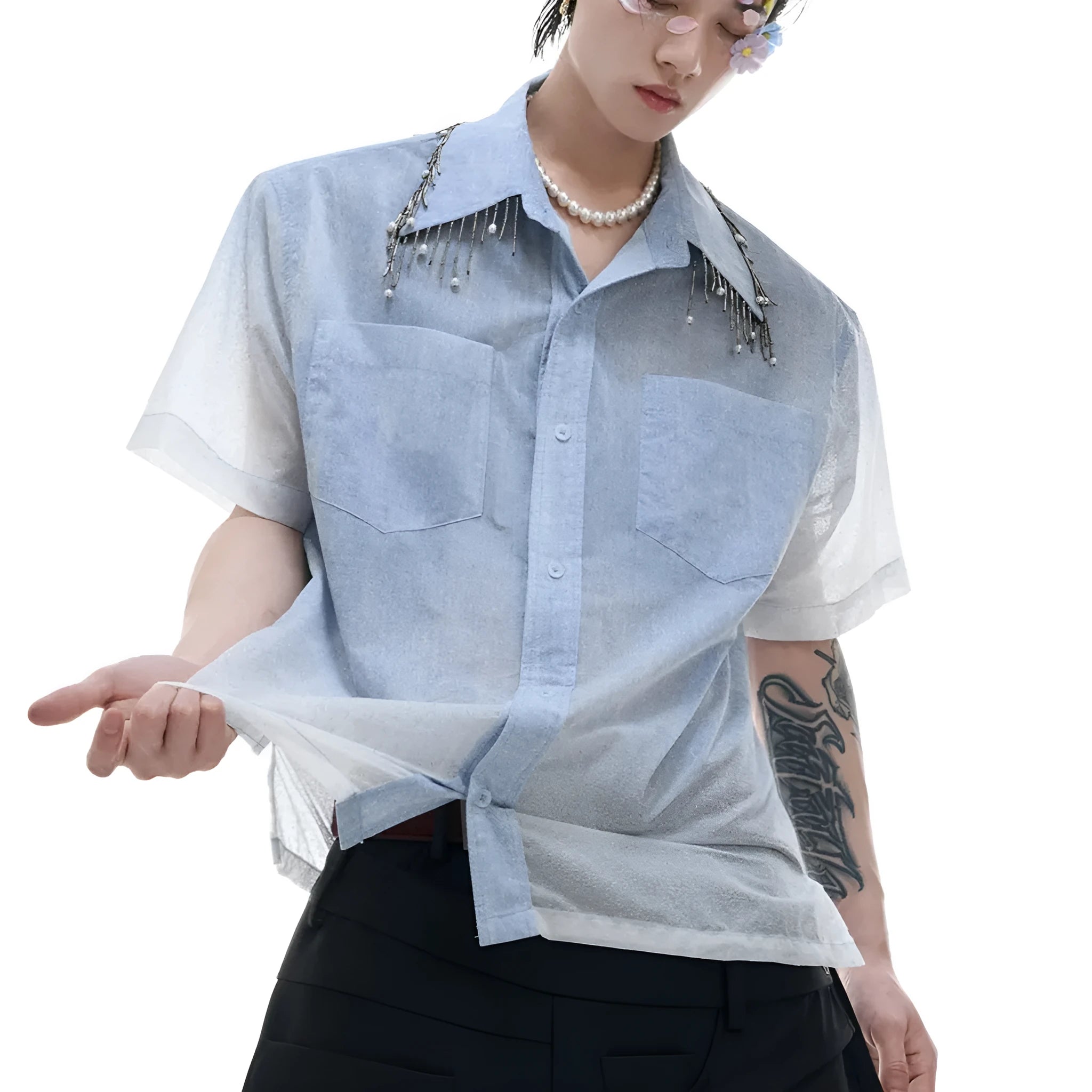 Man modelling a loose fit blue and white gradient shirt with quilted detailing and short sleeves.