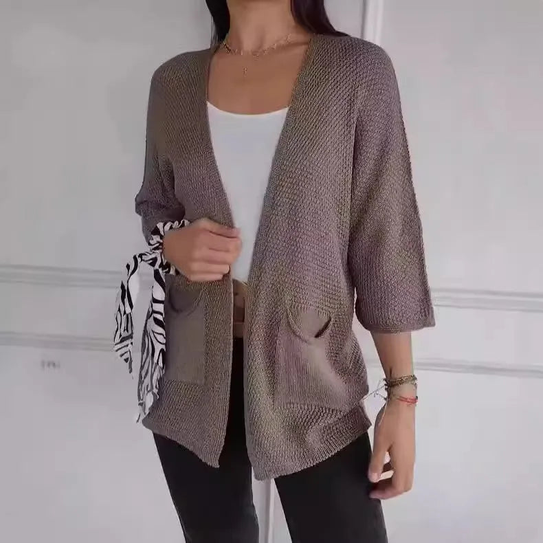 Women's waffle texture cardigan coat with nine-quarter sleeves shown in army green colour.
