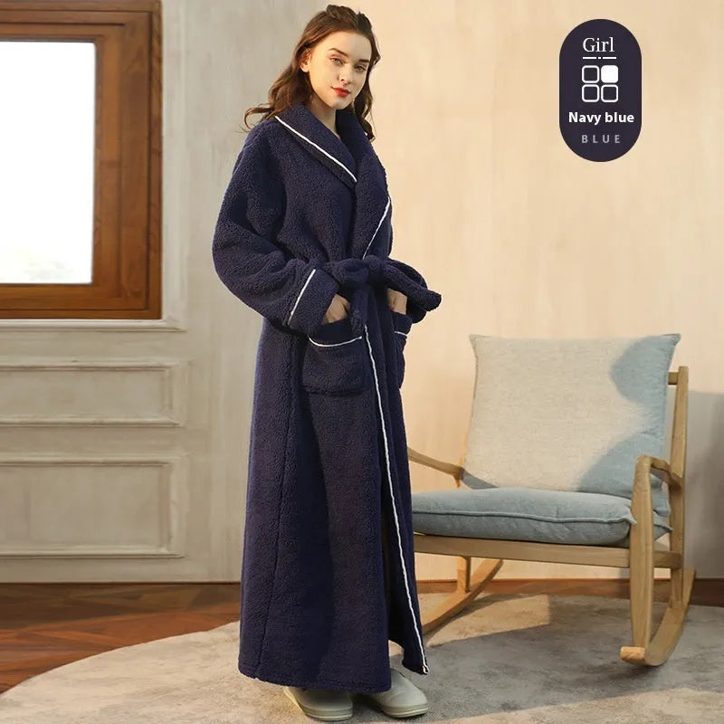 A man and woman wearing matching heavyweight navy blue flannel bathrobes, a couple's winter nightgown set.
