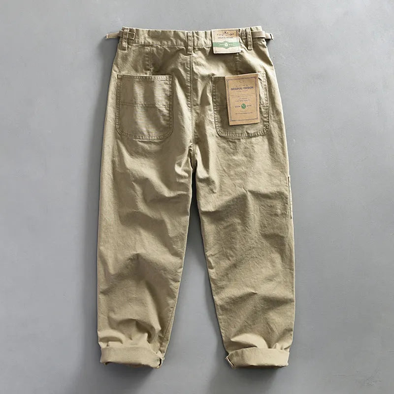 Men's straight fit cotton casual trousers in apricot, shown on a hanger.