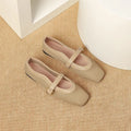 Women's beige mesh pumps with a square toe, buckle fastening, and a low flat heel.