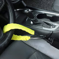 Red iron wire rope steering wheel lock for General Motors cars on a steering wheel.