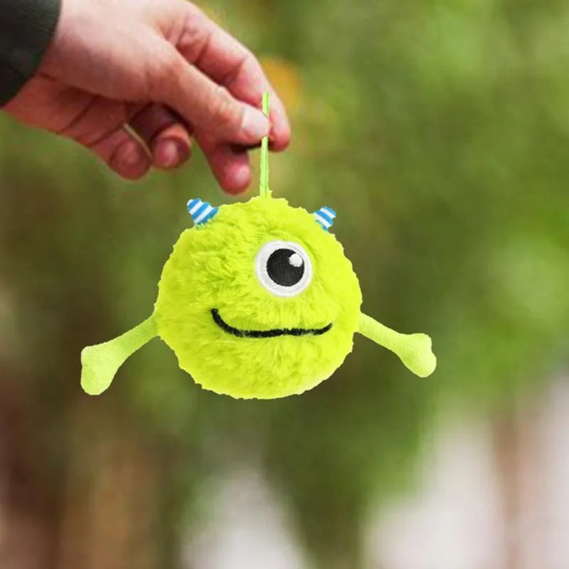 Green sound-activated dog teething ball toy with plush exterior