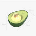 Green avocado-shaped mini humidifier with USB cable and night light on a desk