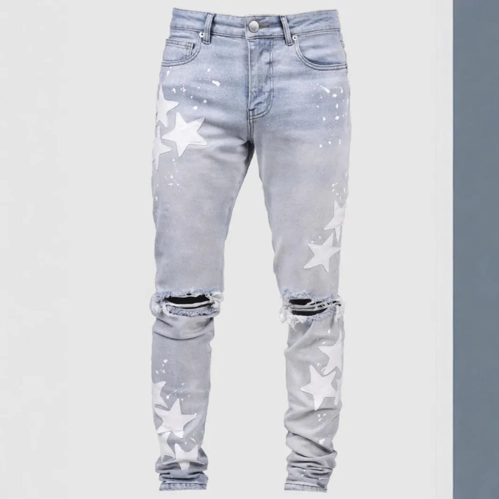 Men's slim stretch blue jeans with embroidery detail on denim fabric.