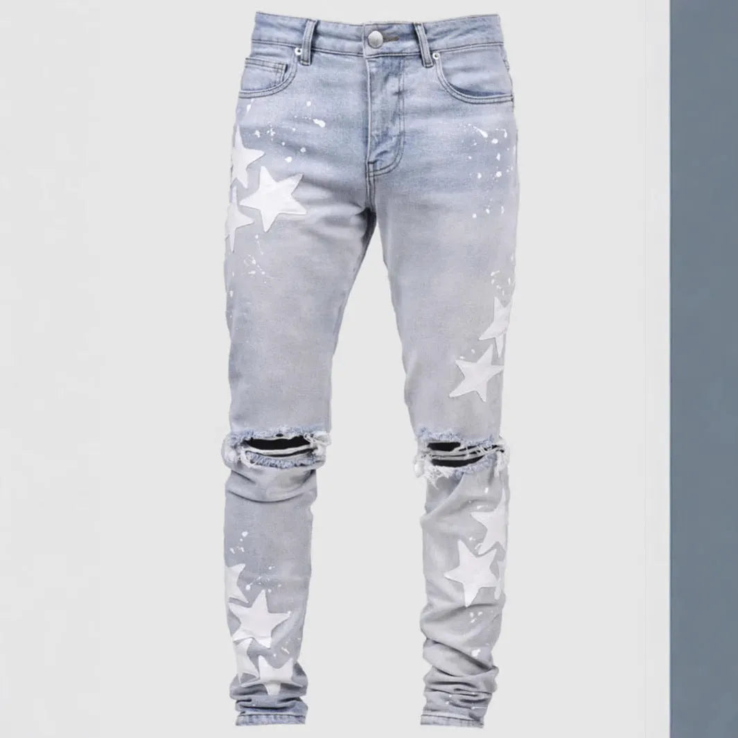 Men's slim stretch blue jeans with embroidery detail on denim fabric.