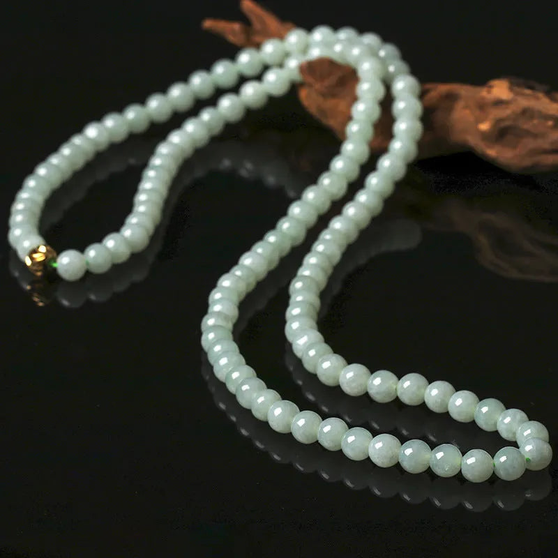 Adjustable jade bead necklace with white green round beads showing length adjustment from 21cm to 50cm
