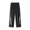 A man wearing black straight-leg loose-fit casual sports trousers for summer.